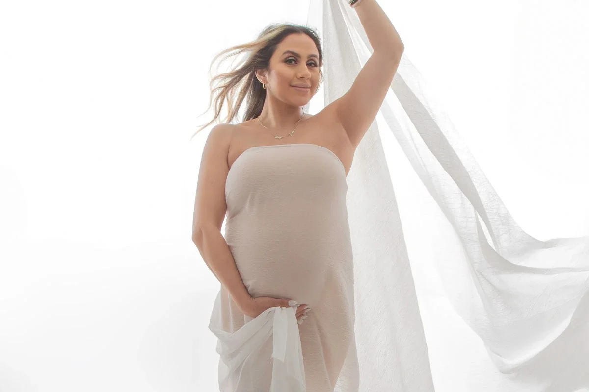 Maternity portrait in a white dress