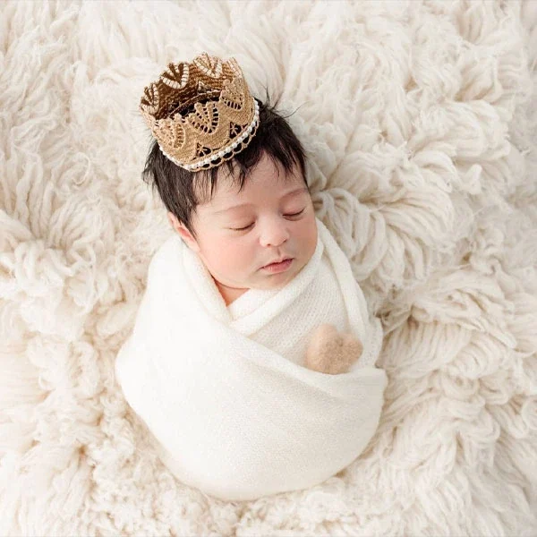 Newborn portrait on a soft cream blanket